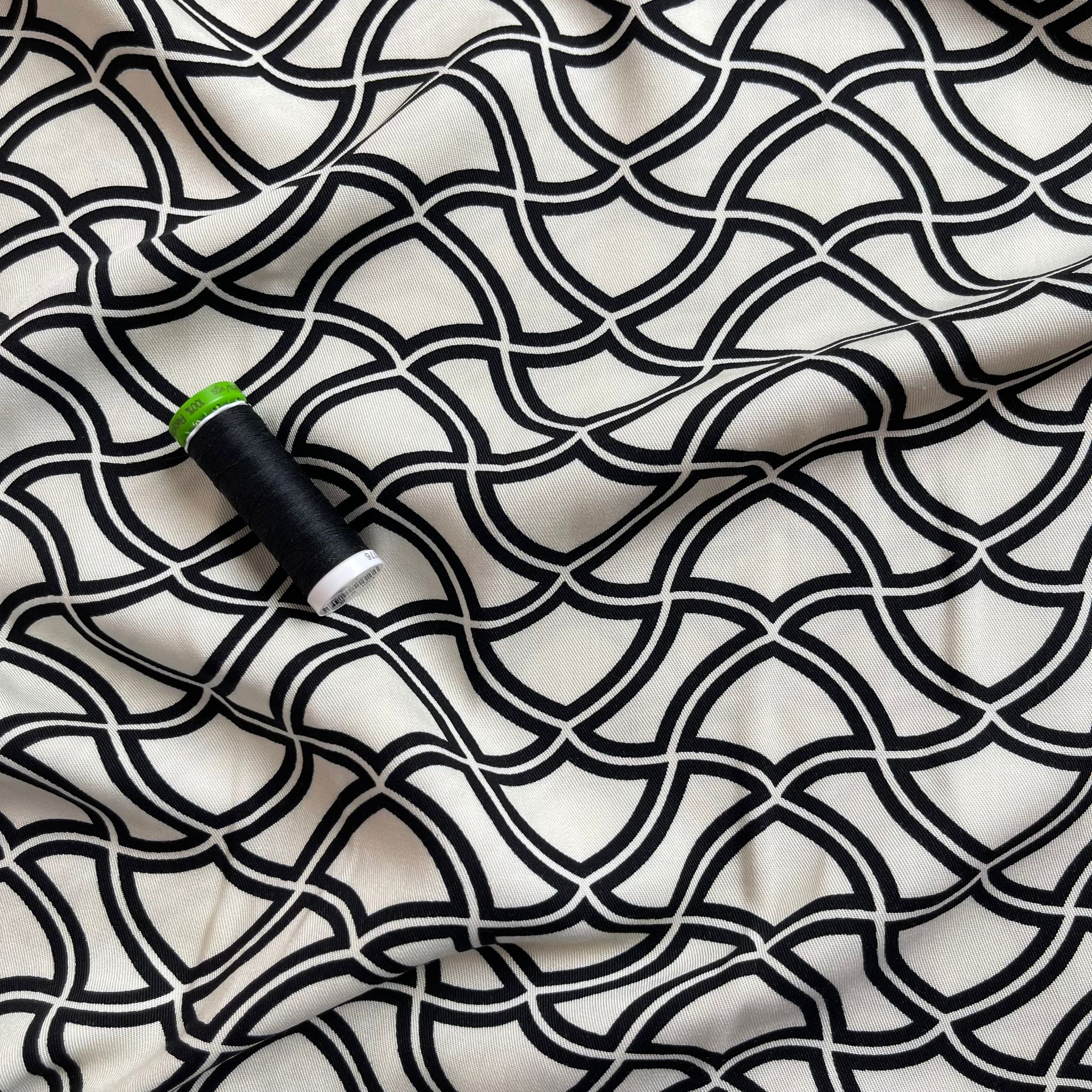 Abstract Waves on Off-White Viscose Twill Fabric - Image 5